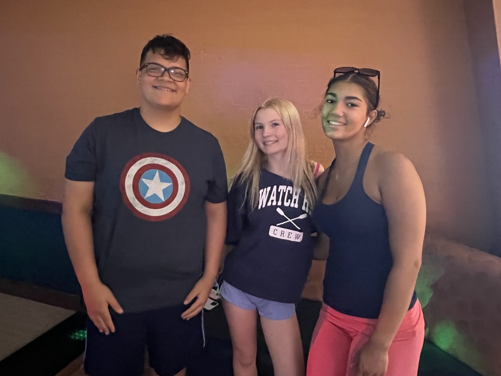 students posing in bowling alley
