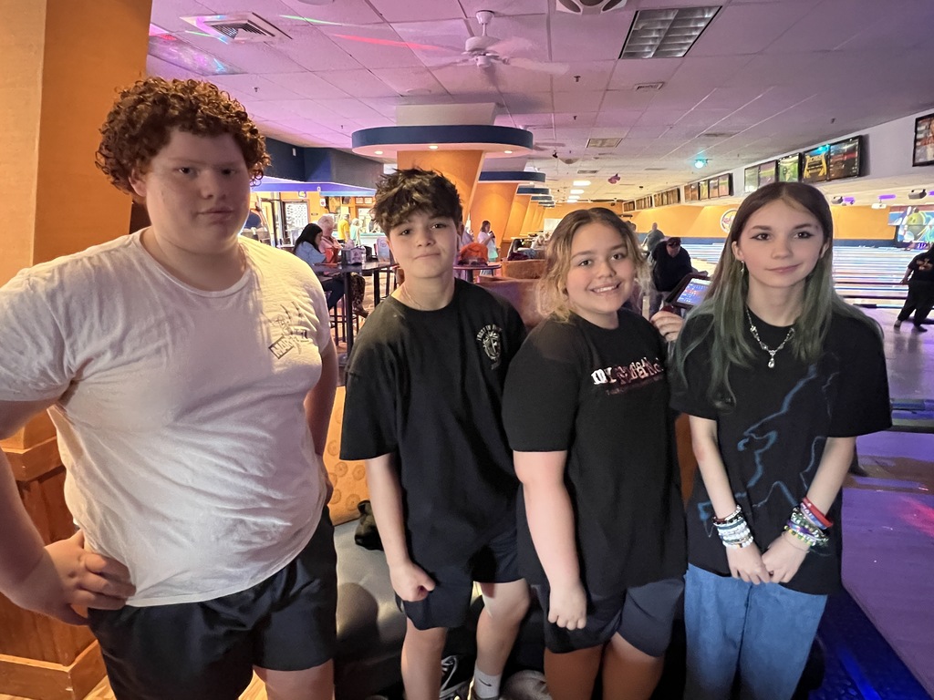 Students posing in bowling alley