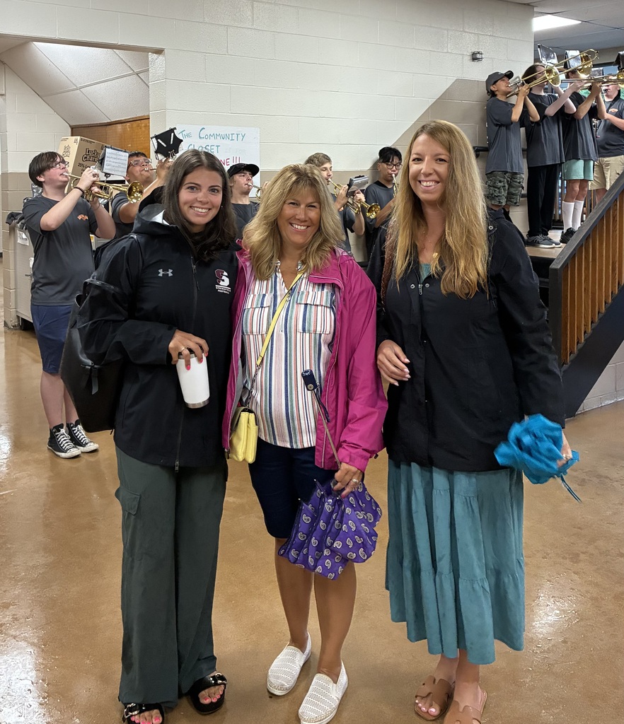 Teachers arriving with the Band playing behind them