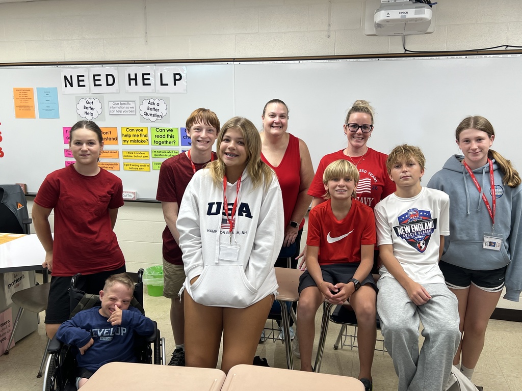 students and teachers wearing red white blue attire