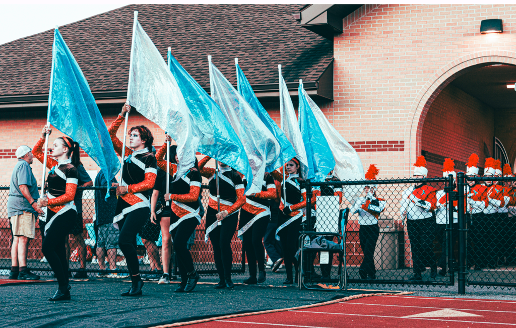 AHS guard and band entering the stadium