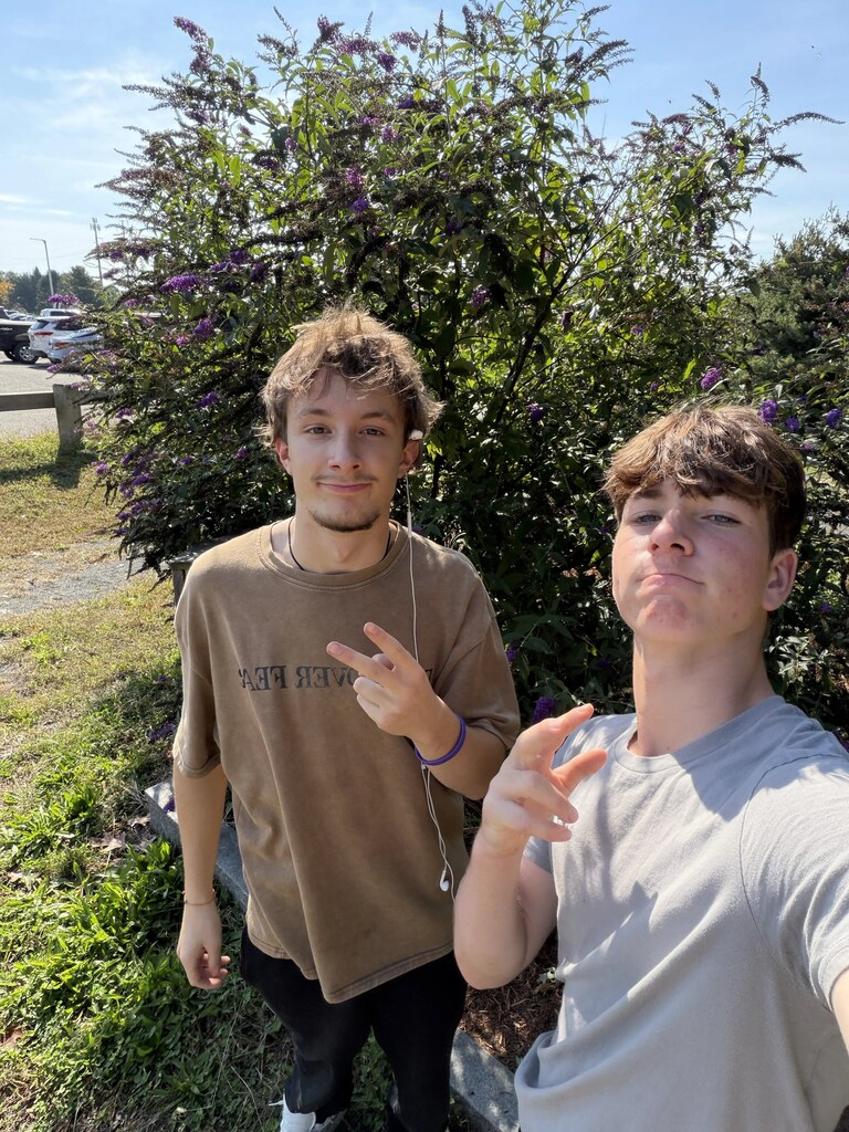two students in the pollinator garden