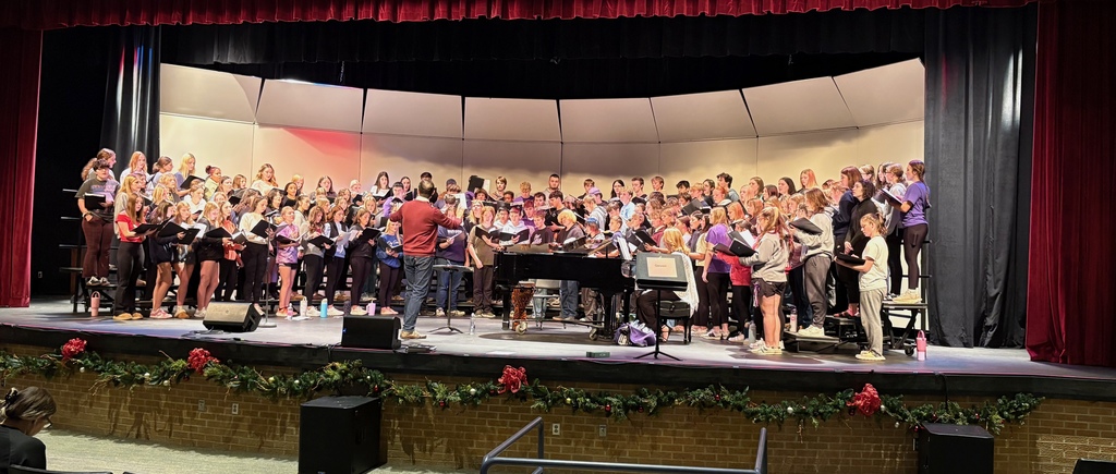 Members of the AGWSR HS choir practicing at the NICL Conference Choir Festival. 