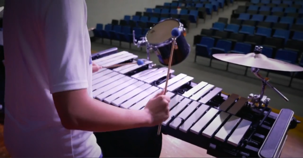 Band student playing in drumline close up.