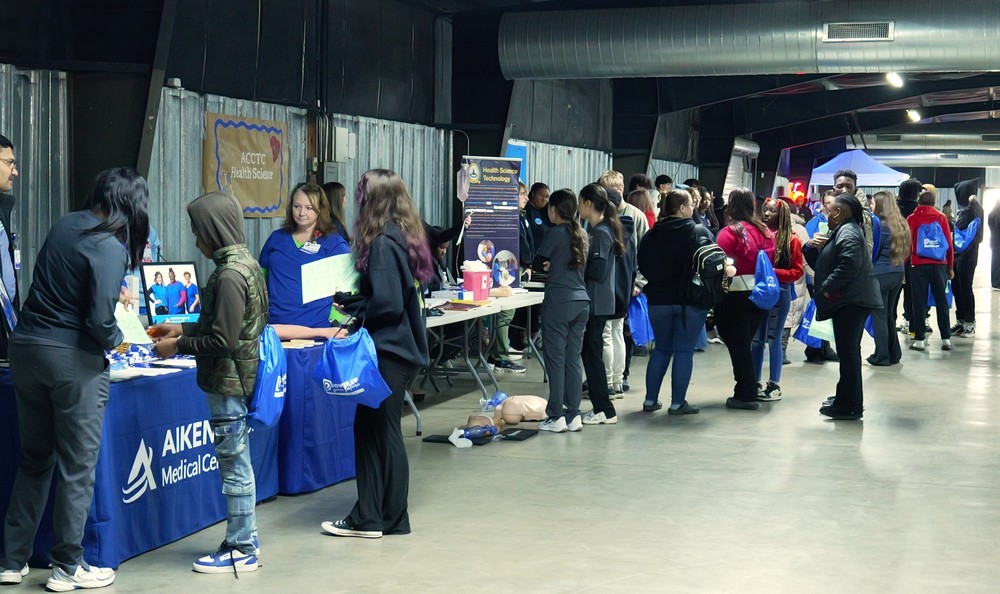 Students waiting at booths at the Power Up Career Day.