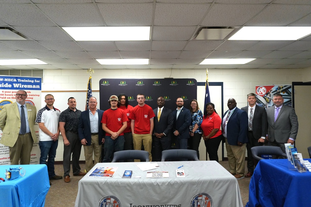 Three CTE Students are joined by ACPSD District Leadership and local trade unions for MOU signing.