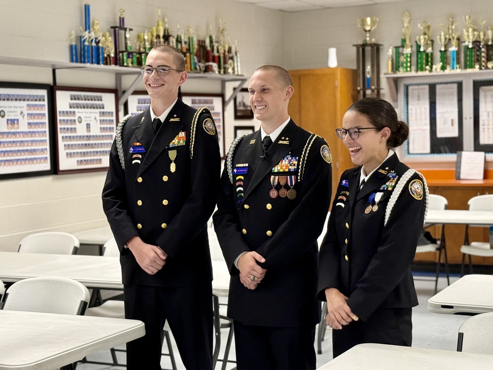 Three NJROTC Cadets in uniform smiling at Midland Valley High.