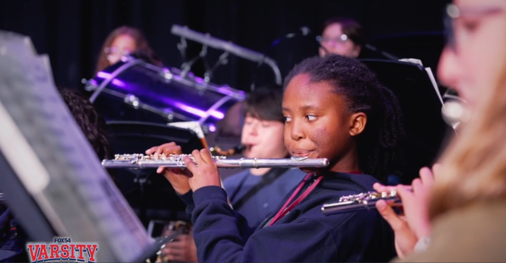 Student playing an instrument .