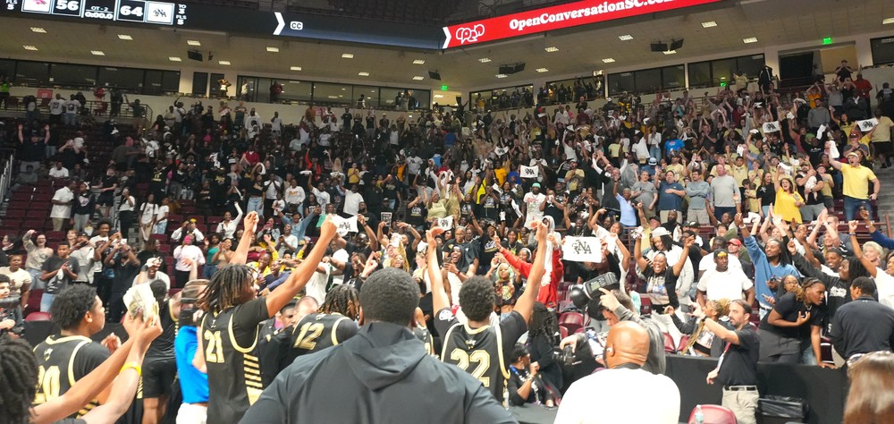 North Augusta boys basketball rushes to meet fans.
