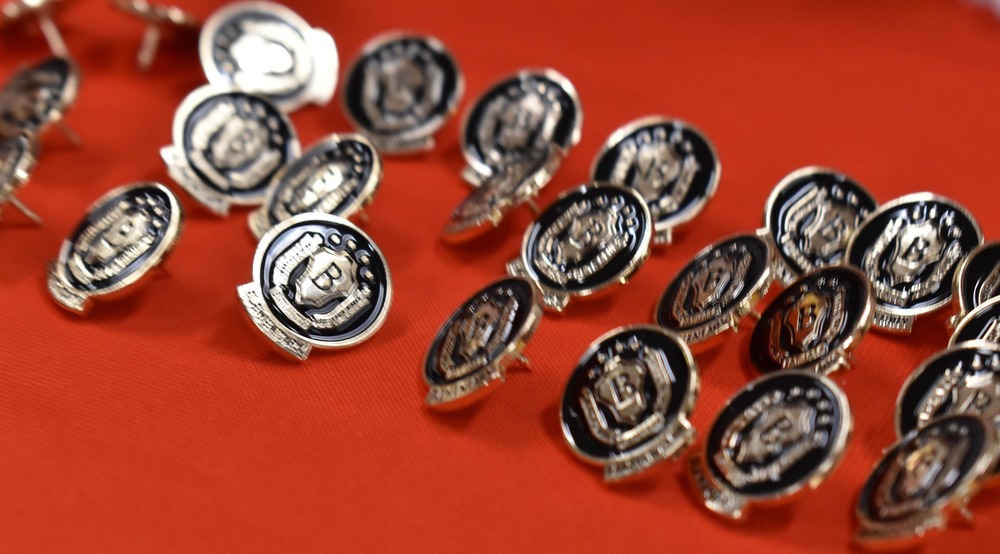 Beta Club pins sitting on table.