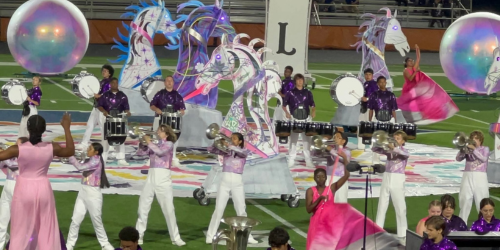 Band playing on field with 
