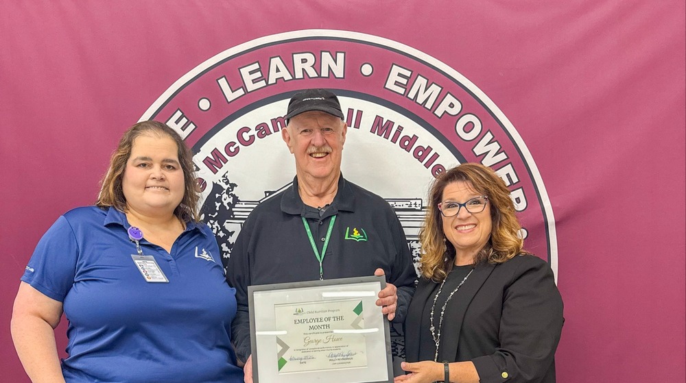 Child Nutrition Employee George Howe Stands with Child Nutrition Coordinator Polly Peyinghaus and Child Nutrition Field Supervisor Jenny Hill for a photo