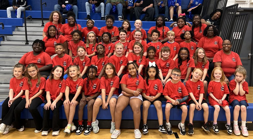Bear Cubs sitting on bleachers.