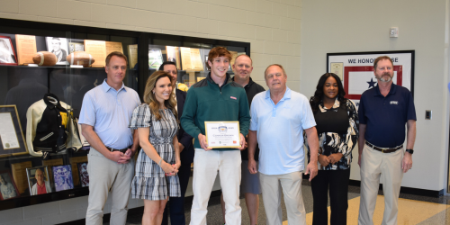 WJBF Award presented to C Brown with family and friends.