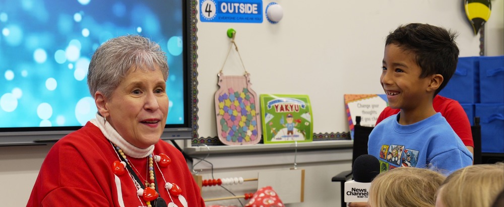 Christine Witt speaks with her students.