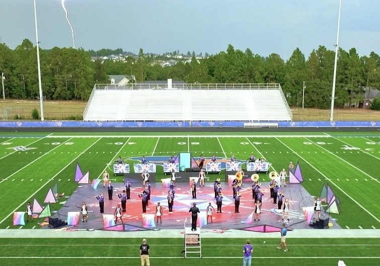 A marching band on a football field.