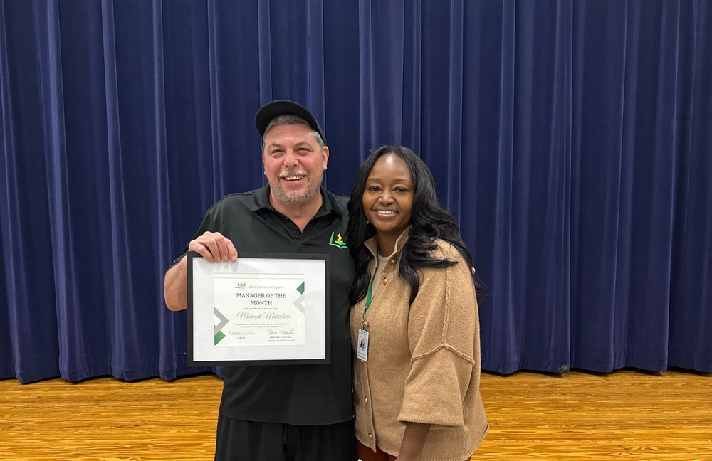 Child Nutrition Manager Michael Marcelain stands with Chartwells Resident District Manager Ebonee Maxwell for a picture.