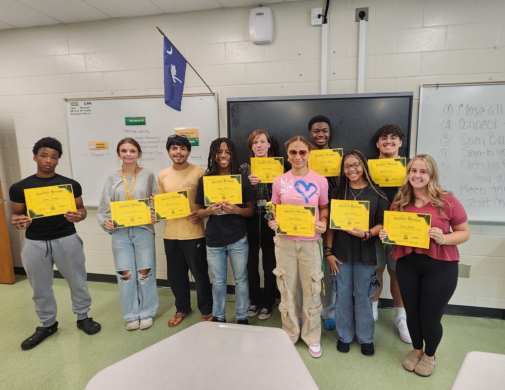 Group of students holding certificates