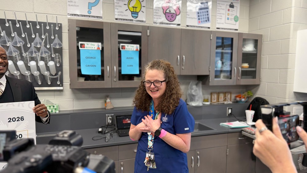 Dr.Christie Padallino being surprised in a classroom with her students and district staff.