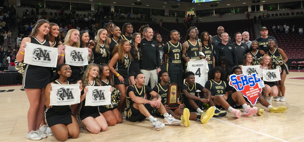 North Augusta High School boys' basketball team celebrates first title win.