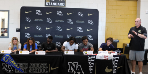 Students at signing table at NAHS. 