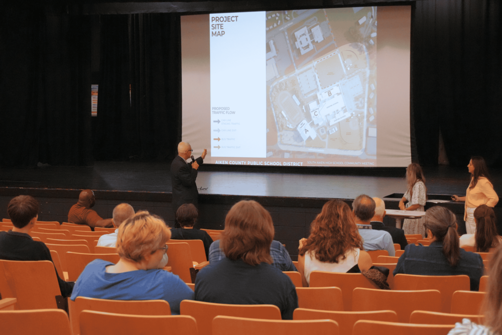 Community members listening to presentation of future SAHS renovations.
