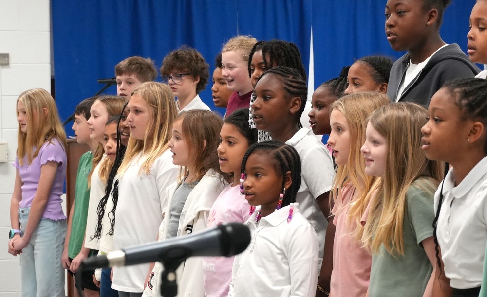 Children sing "Lift Every Voice and Sing".