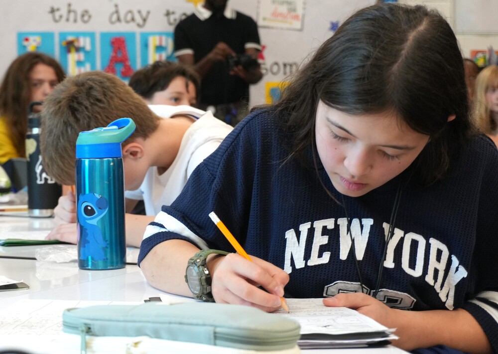 Student at Hammond Hills Elementary writes down notes.
