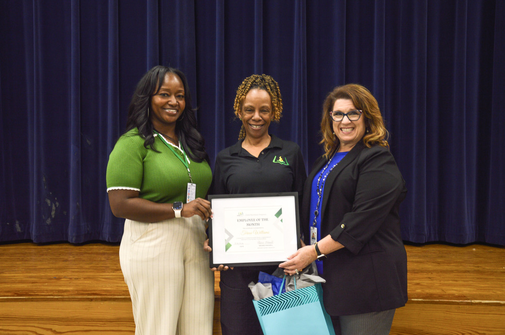 Schofield Middle Child Nutrition Operator Teresa Williams stands with Child Nutrition Coordinator Polly Peyinghaus and Chartwells Resident District Manager Ebonee Maxwell for a picture