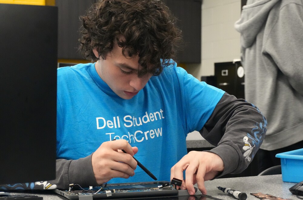 North Augusta high school student works on motherboard of a computer.