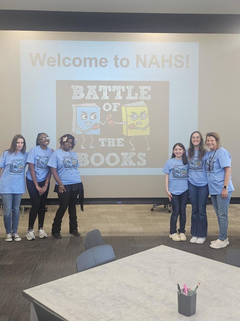 4 Students and 2 teachers in front of Battle of the Books Screen.