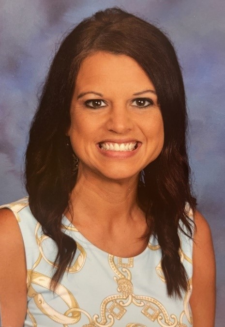Brunette female smiling.