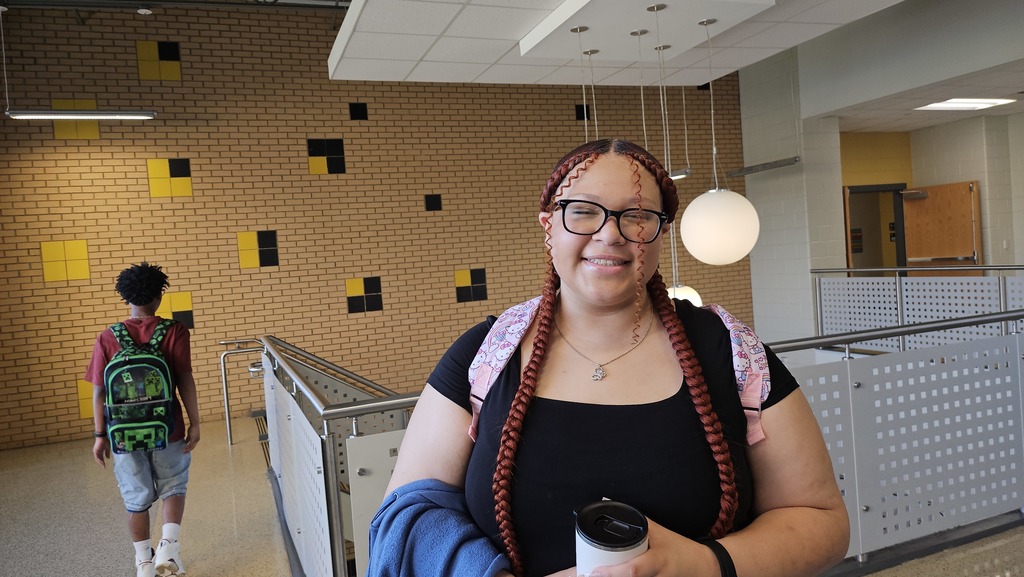 Smiling girl in hallway.