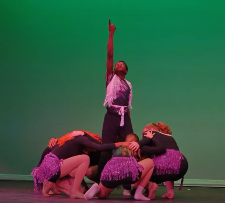 Students performing on a stage during the Summer acGateway program