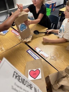 Second Grade class making friendship cups
