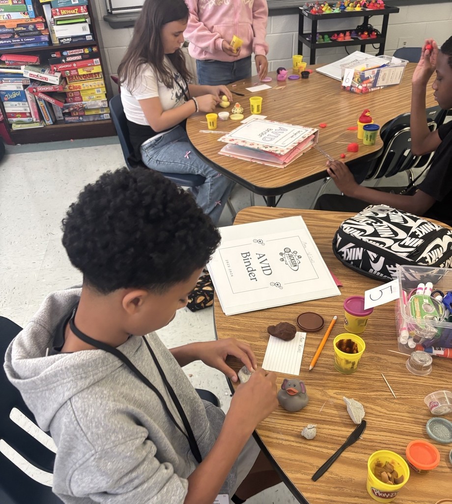 AVID student creating a clay sculpture.