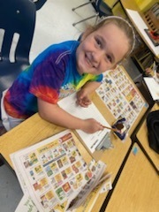 Student working on rounding to the nearest dollar