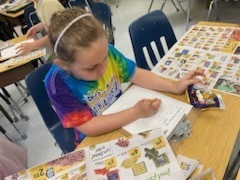 Student working on rounding to the nearest dollar