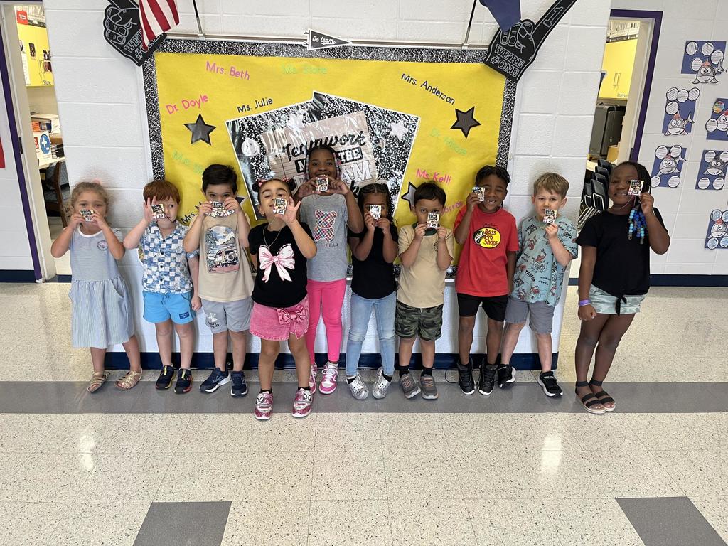 Kindergartener's Holding Brag Tags