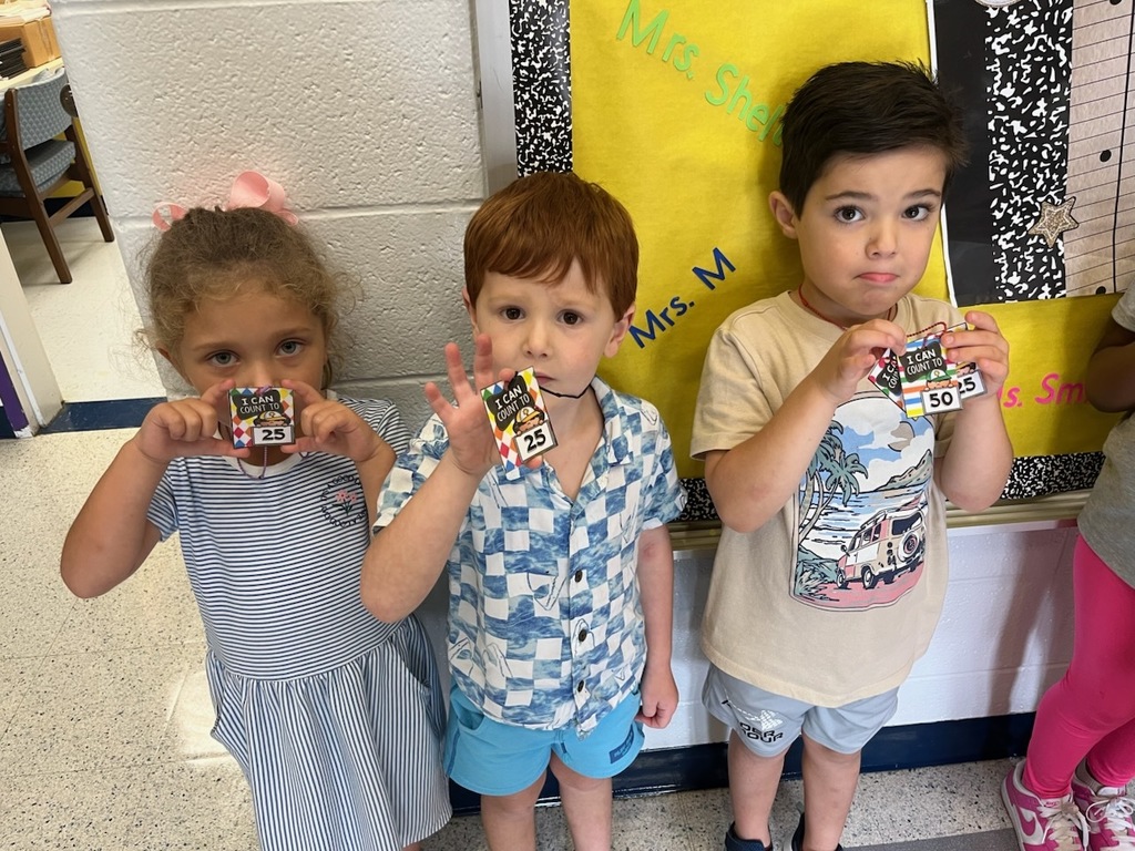 Kindergartener's Holding Brag Tags