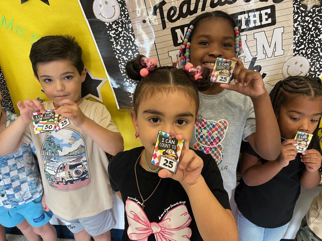 Kindergartener's Holding Brag Tags