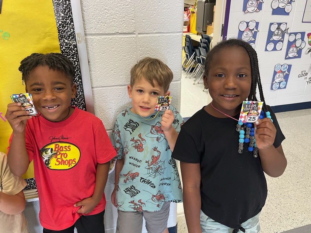 Kindergartener's Holding Brag Tags