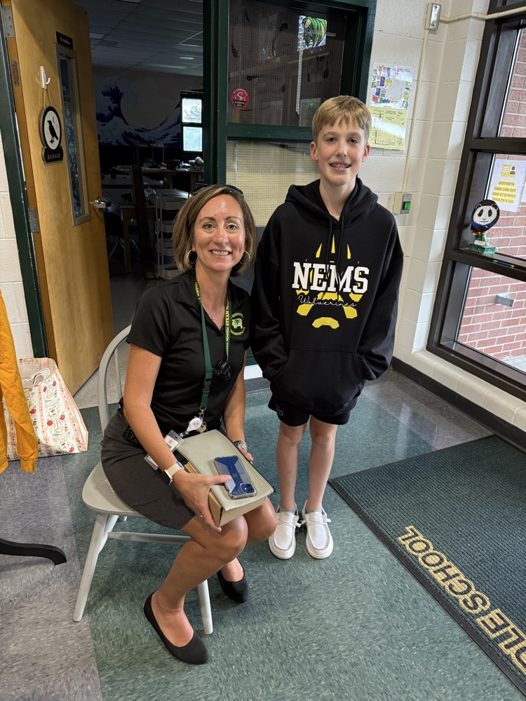 student and teacher posing for picture