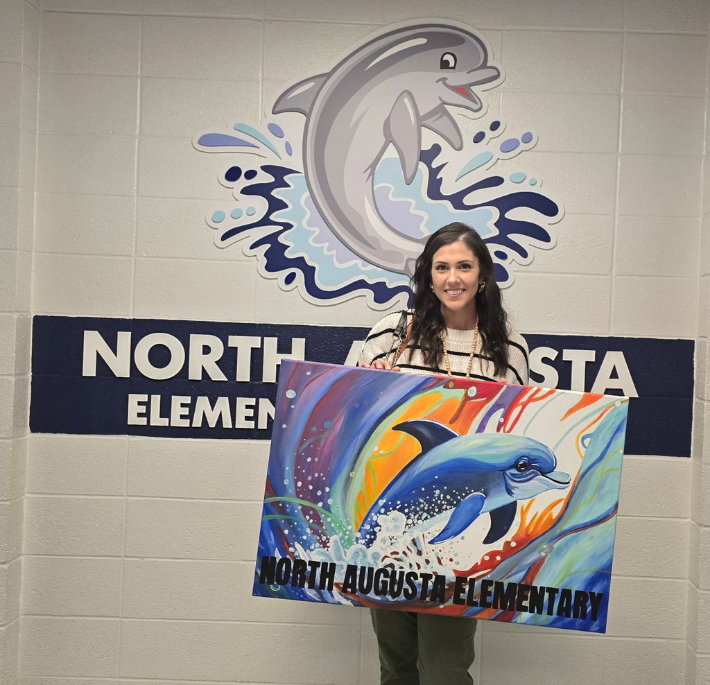 Teacher displaying her art