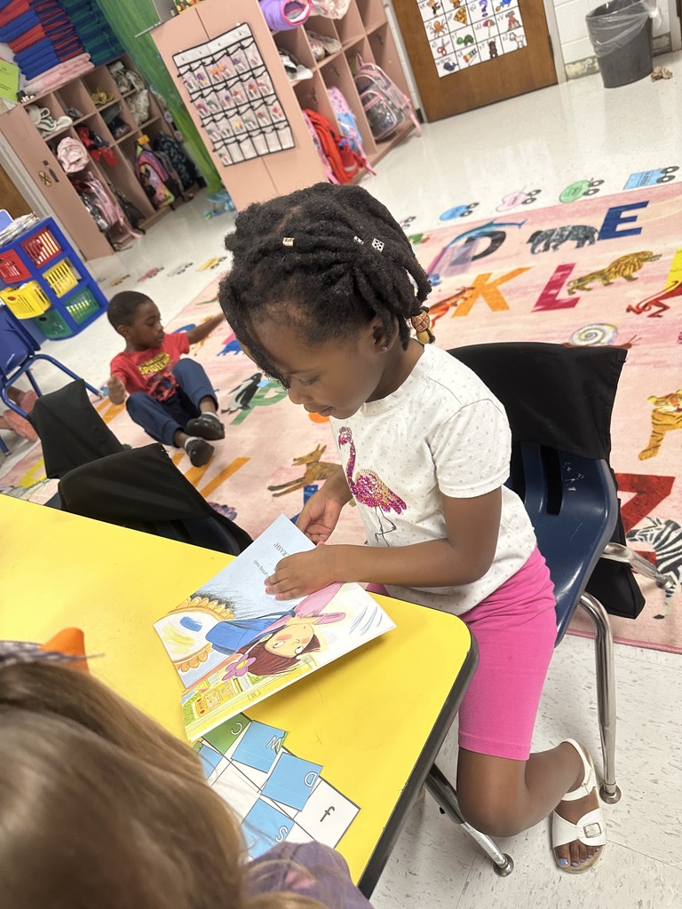 Student reading at table.