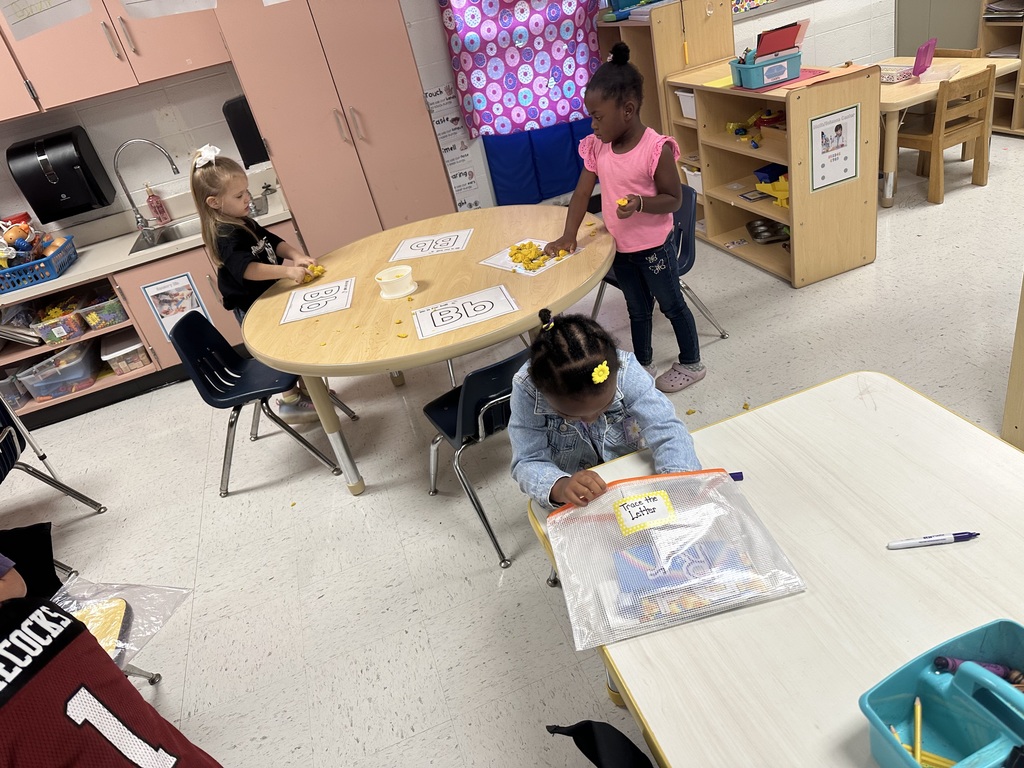 Students working at table.