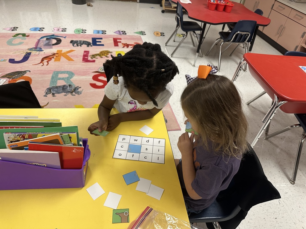 Students working at table.