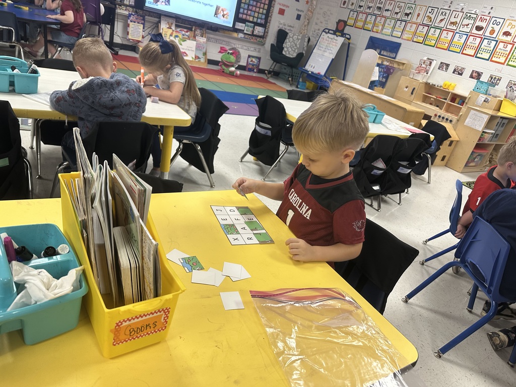 Students working at table.