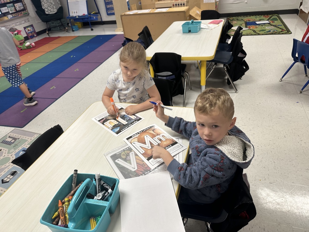 Students working at table.