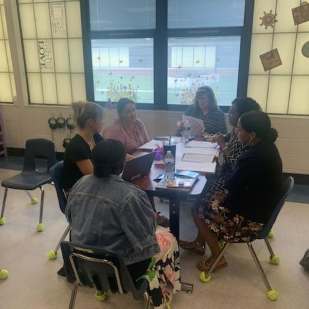 group of teachers discussing 